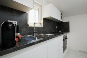 Kuchyňa alebo kuchynka v ubytovaní Fratelli apartments