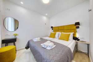 a bedroom with a bed with two towels on it at Sidra city apartment in Zadar