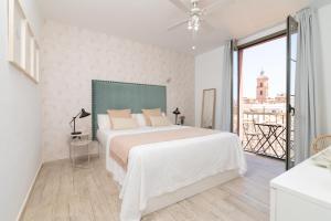 A bed or beds in a room at iloftmalaga Carretería - Puerta de Antequera