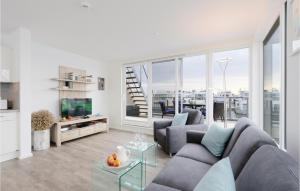 a living room with a couch and a tv at Gorgeous Ship In Ostseeresort Olpenitz in Olpenitz +24 photos