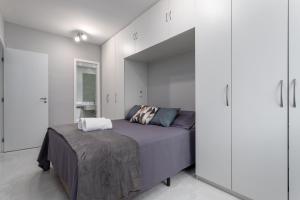 Uma cama ou camas num quarto em Cidade Jardim 2 bedrooms apartment within a resort