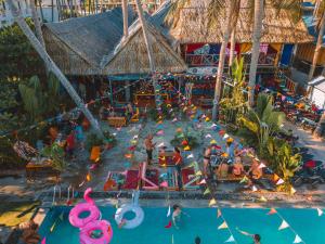 an overhead view of a pool with people at a resort at iHome Backpacker Resort in Mui Ne