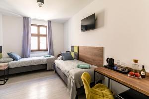 Posteľ alebo postele v izbe v ubytovaní Cooltour
