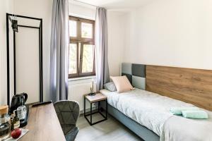 Posteľ alebo postele v izbe v ubytovaní Cooltour