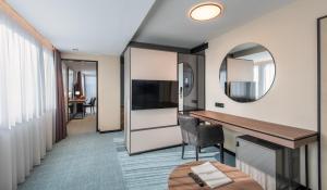 Televízia a/alebo spoločenská miestnosť v ubytovaní Hunguest Hotel Bál Resort
