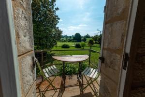 Zahrada ubytování Suite campagnarde près Bordeaux, vue sur les vignes au Château Camponac