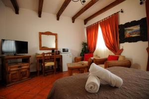 Un pat sau paturi într-o cameră la Hotel Las Cañadas