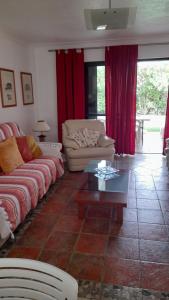 a living room with a couch and a coffee table at Semi-Detached Villa in Vilamoura