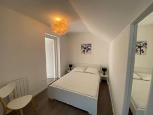 Posteľ alebo postele v izbe v ubytovaní Maison de vacances pour 8 personnes STELLA PLAGE - Villa POPPEE