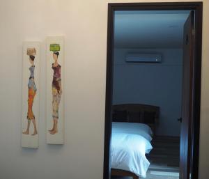 Postel nebo postele na pokoji v ubytování Bondi Homestay