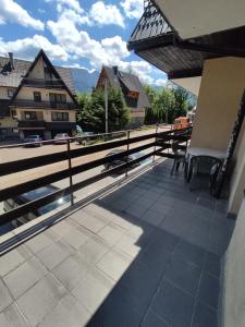a balcony with a view of a building at Pokoje na Sobczakówce in Zakopane