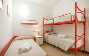 a room with two bunk beds in a room at Trilo Beach in Monte Nai +8 photos