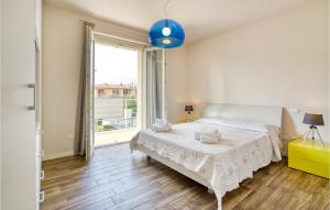 A bed or beds in a room at Amazing Home In Puegnago Sul Garda