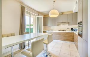 A kitchen or kitchenette at Amazing Home In Puegnago Sul Garda