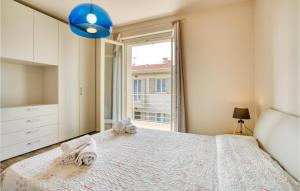 A bed or beds in a room at Amazing Home In Puegnago Sul Garda