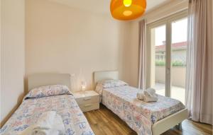 A bed or beds in a room at Amazing Home In Puegnago Sul Garda