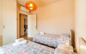 A bed or beds in a room at Amazing Home In Puegnago Sul Garda