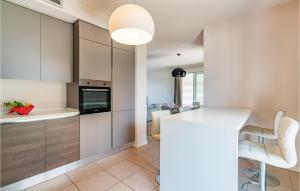 A kitchen or kitchenette at Amazing Home In Puegnago Sul Garda