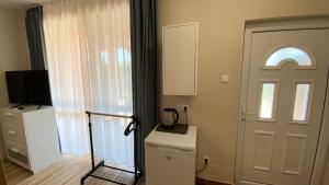 Kuchyň nebo kuchyňský kout v ubytování Korall Apartman