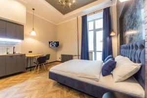 Postel nebo postele na pokoji v ubytování Secret Apartments