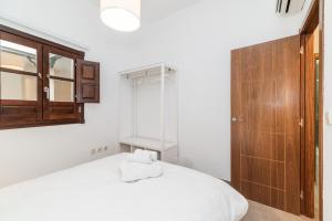Posteľ alebo postele v izbe v ubytovaní Modern Cozy flat in Granada's city centre 1