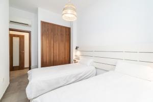 Posteľ alebo postele v izbe v ubytovaní Modern Cozy flat in Granada's city centre 1