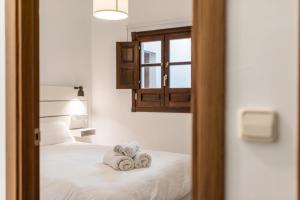 Posteľ alebo postele v izbe v ubytovaní Modern Cozy flat in Granada's city centre 1