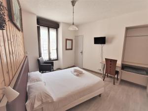 TV a/nebo společenská místnost v ubytování Terminus Hôtel des 3 Vallées