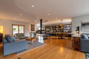 a living room with two couches and a fireplace at Villa Tojeira in Sintra