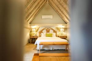 Postel nebo postele na pokoji v ubytování Hotel Casa Canabal by Faranda Boutique