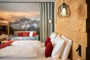 Ein Bett oder Betten in einem Zimmer der Unterkunft Hotel Ortles B&B