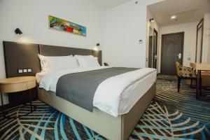Voodi või voodid majutusasutuse Graphic Hotel Batumi toas
