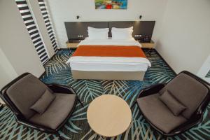 Voodi või voodid majutusasutuse Graphic Hotel Batumi toas