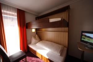 En eller flere senger på et rom på Hotel Sommerer - inklusive Joker Card im Sommer