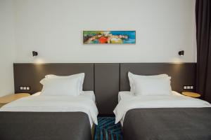 Voodi või voodid majutusasutuse Graphic Hotel Batumi toas