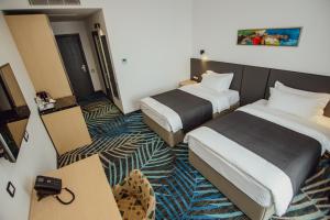 Voodi või voodid majutusasutuse Graphic Hotel Batumi toas
