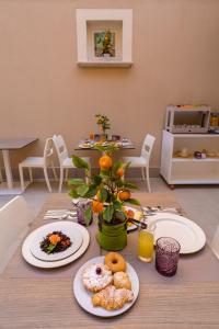 a table with plates of food on top of it at ELISEO PALACE TROPEA in Tropea