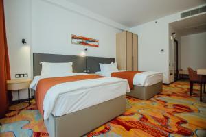 Voodi või voodid majutusasutuse Graphic Hotel Batumi toas