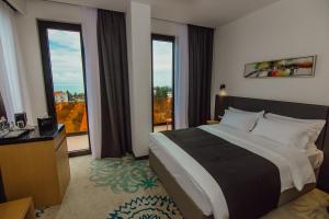 Voodi või voodid majutusasutuse Graphic Hotel Batumi toas