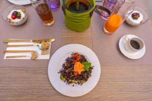 a table with a plate of food on a table at ELISEO PALACE TROPEA in Tropea