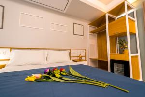 a bedroom with a bed with flowers on it at ELISEO PALACE TROPEA in Tropea