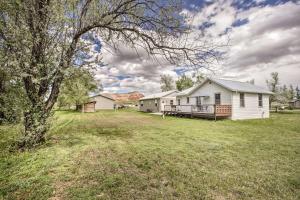 a house in a field with a yard at Lovely Thermopolis Home Less Than 3 Mi to Hot Springs in Thermopolis
