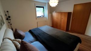 Postel nebo postele na pokoji v ubytování *Gemütliche Ferienwohnung in perfekter Lage*