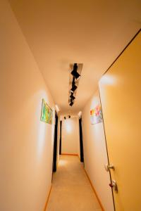 a hallway with white walls and a ceiling at ELISEO PALACE TROPEA in Tropea