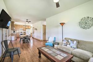 a living room with a couch and a table at Idyllic Gem Screened Porch, half Mi to River! in Thermopolis