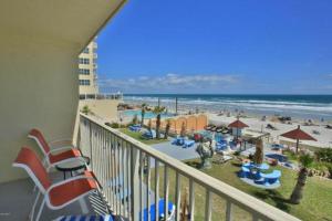 a balcony with a view of the beach and the ocean at Daytona Dream Inn By AmeriVu in Daytona Beach