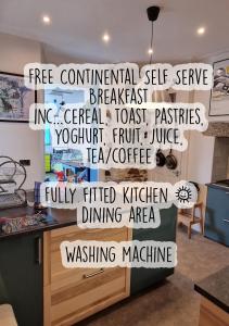 a wall with words on it in a kitchen at Lansdowne Simply Stay in Redruth