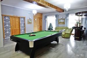 a billiard room with a pool table in it at Góralski Pałacyk in Biały Dunajec