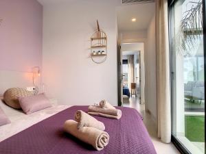 A bed or beds in a room at Villas Alejandra - 7409