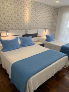 Postel nebo postele na pokoji v ubytování Hostal San Fernando